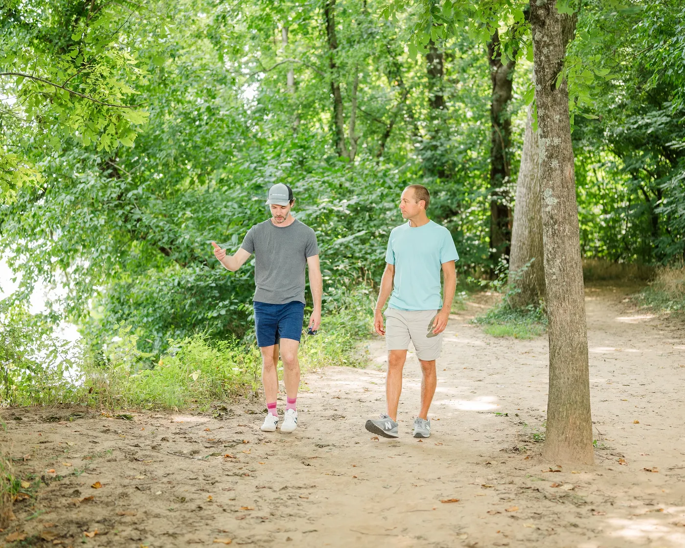 Two men in conversation while walking a James River Park trail