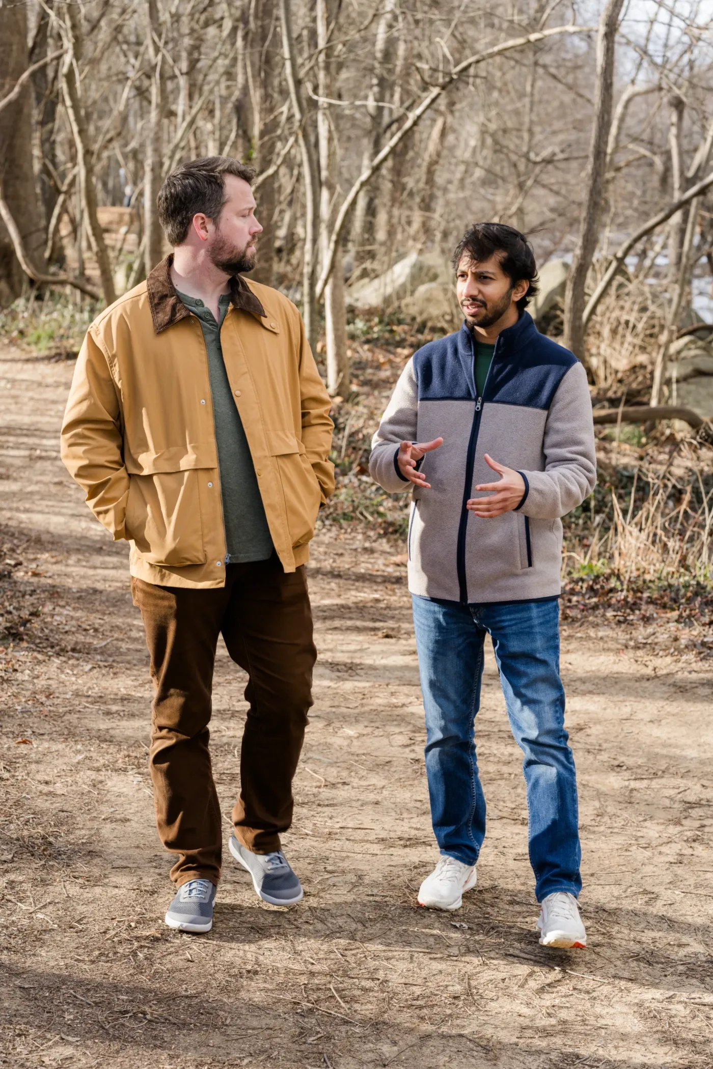 Two men walking a James River trail in winter